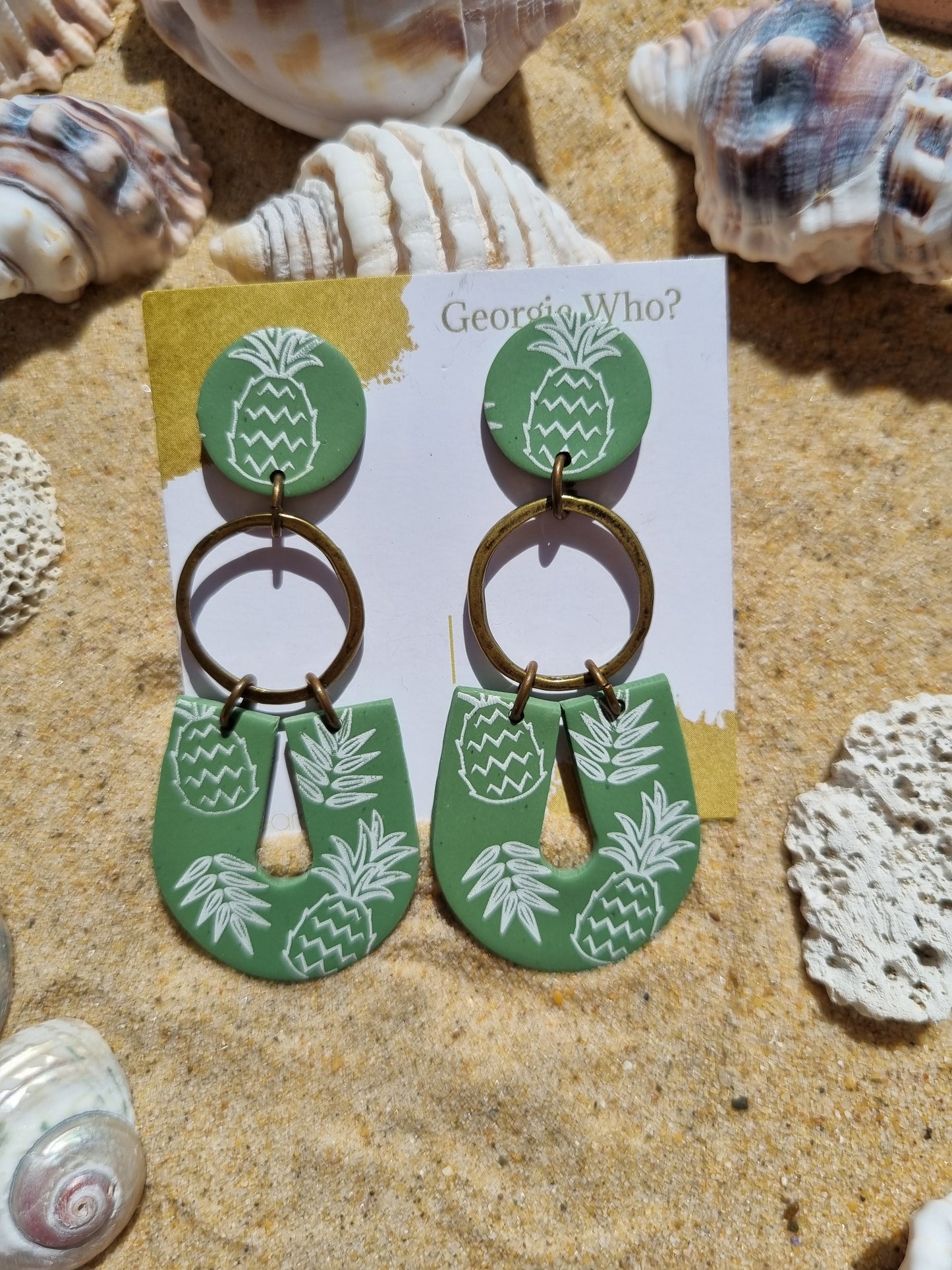 Sage green polymer clay earrings with white pineapple print, handmade in Australia