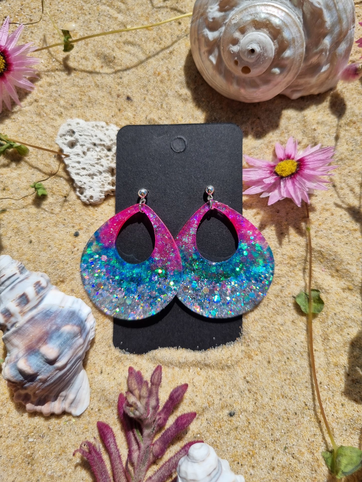 Glitter and resin handmade earrings looks like an Electric Sunset