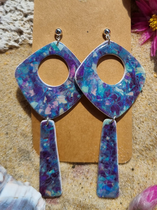 Polymer clay earrings with a mosaic of shimmering blues and purples  like the sea floor.