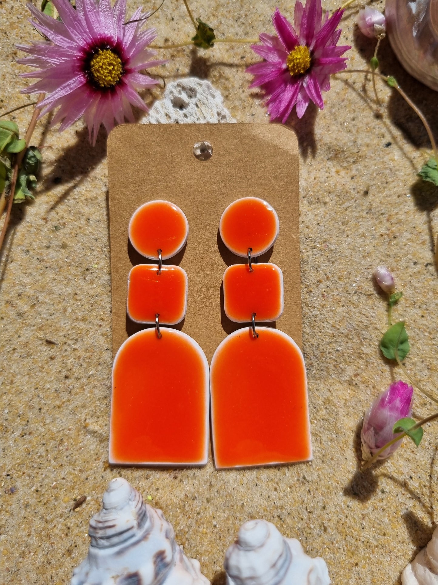 Resin glazed polymer clay earrings in retro tangarine
