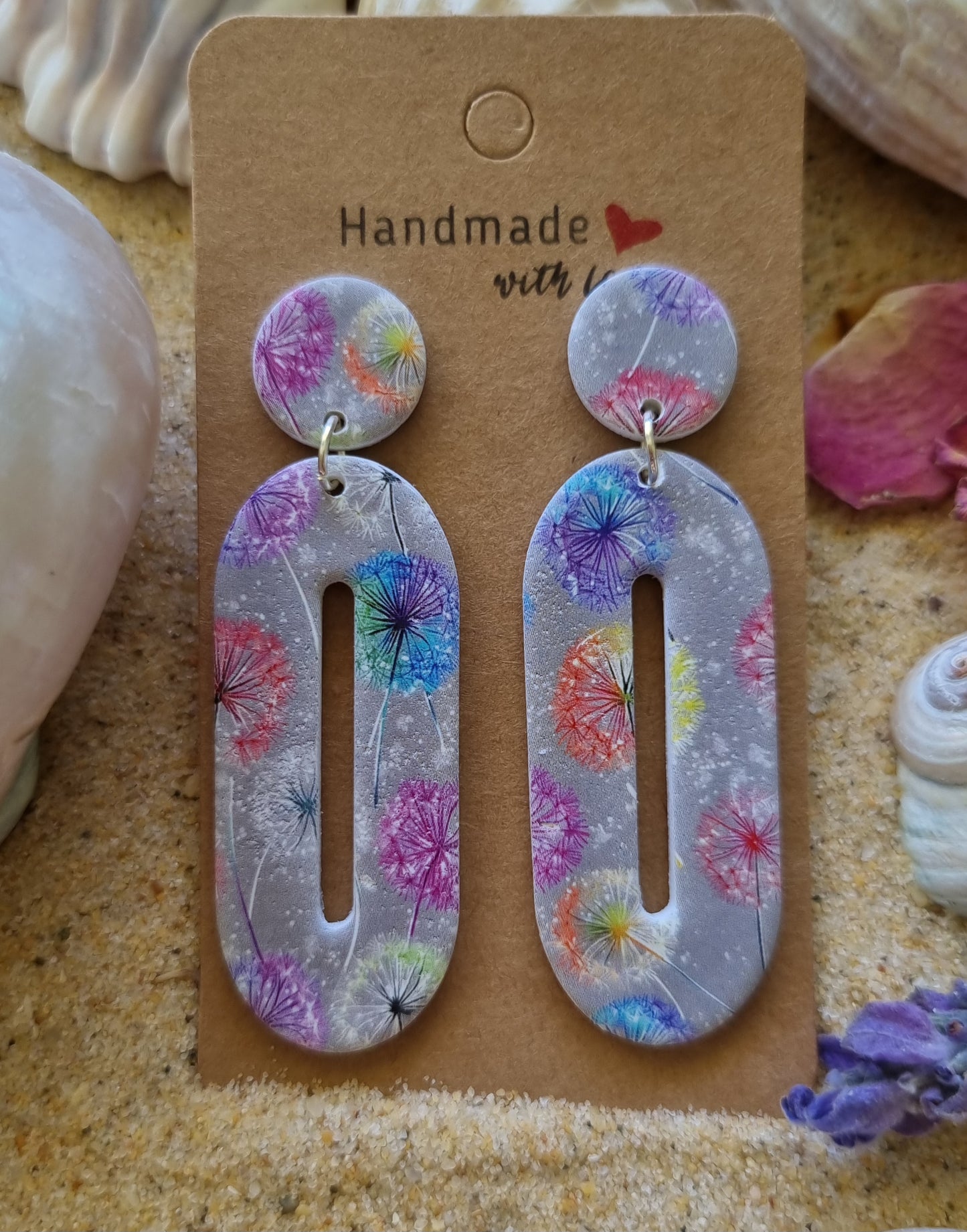 Polymer clay grey earrings with watercolor dandelions scattered about, made by Georgie Who in Australia 