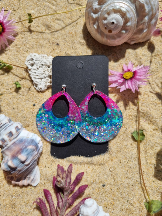 Glitter and resin handmade earrings looks like an Electric Sunset 