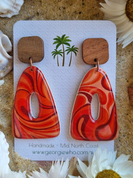 Pair of orange and red marbled polymer clay and resin handmade earrings