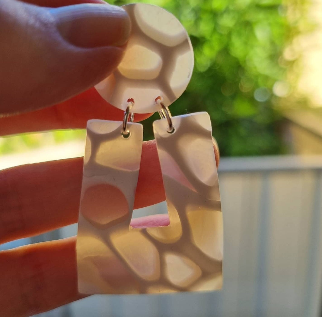 Translucent polymer clay earrings like waves on seashore