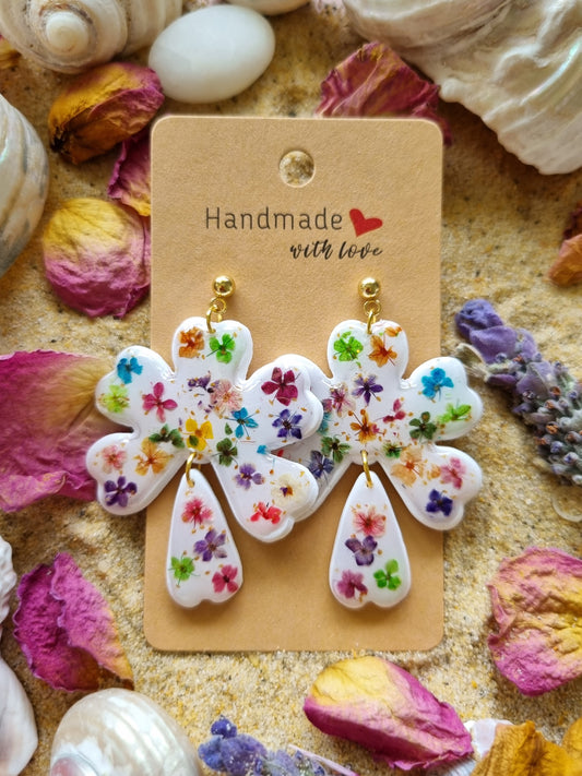 Handmade flower-shaped earrings with dried flowers set on polymer clay white background, handmade in Australia 
